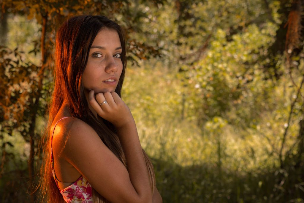 Felicity Ruiz posing against a wooded backdrop